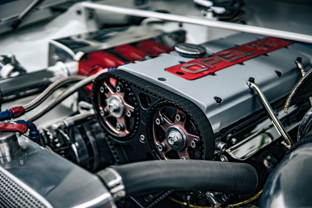 Detailed image showing the inner workings of an Opel car engine with components in focus.