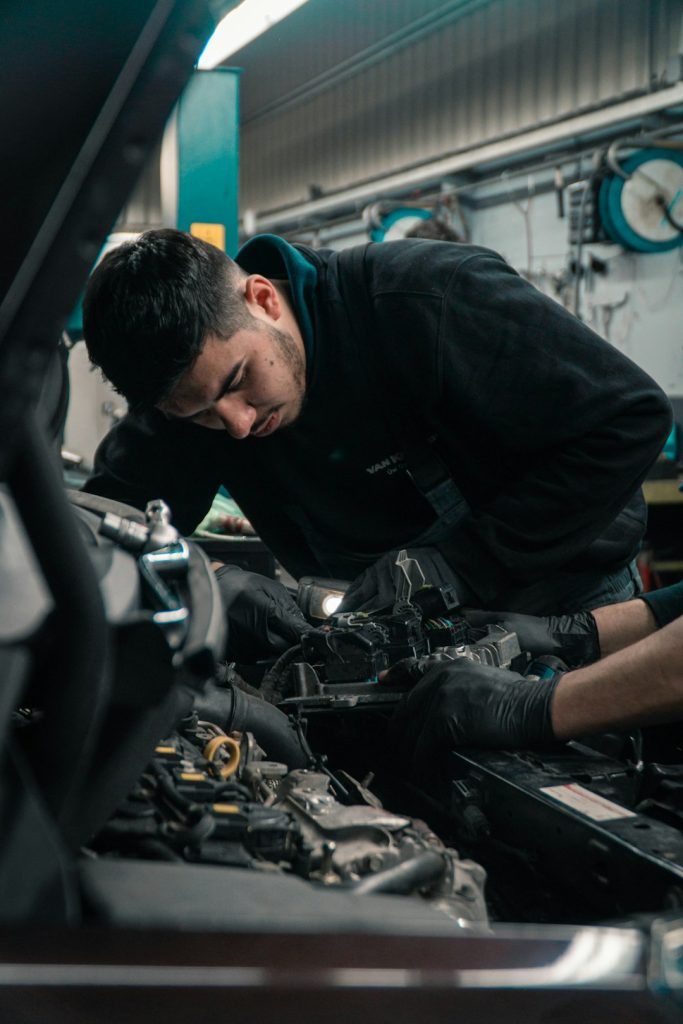 Mechenic working on a car.